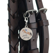 Front view of the Just Jump Dapplebay Bridle Charm on a brown bridle