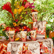 View of the Blue Stallion Farm Floral Bouquet collection on a vibrant table display including the Blue Stallion Farm Rocky Travel Mug