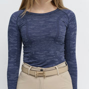 Front view of a female model wearing the Classic Navy Camo TKEQ Kennedy Seamless Long Sleeve Shirt 2.0 on a white background