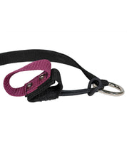 Close-up view of the maroon Nunn Finer Rapid Release Trailer Tie on a white background