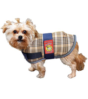 Side view of a small dog wearing the 5/A Baker Dog Blanket on a white background