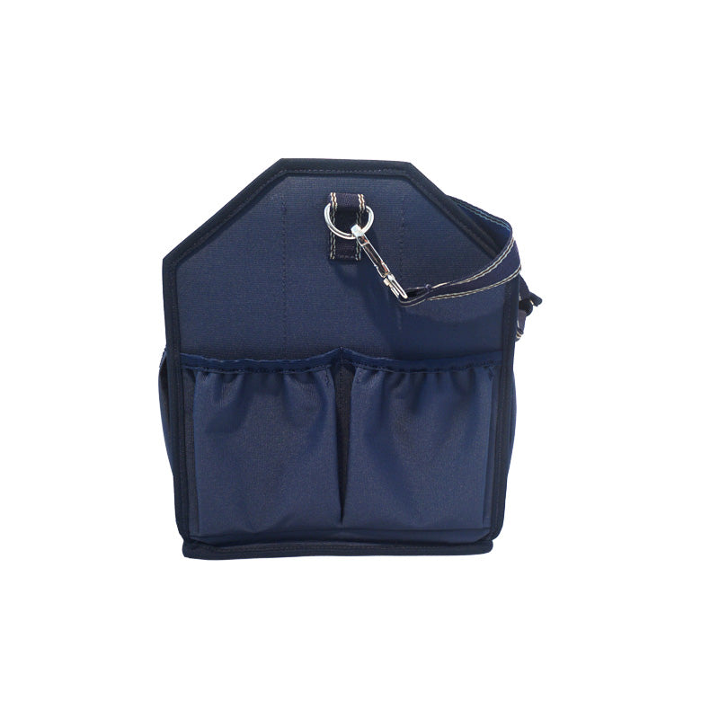 Side view of the navy Kavalkade Cleaning Bag on a white background