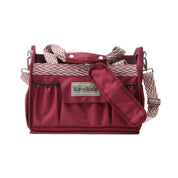 Front view of the red Kavalkade Cleaning Bag on a white background