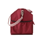 Side view of the red Kavalkade Cleaning Bag on a white background
