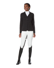 Full body front view of a female model wearing the white Kerrits Crossover II Full Seat Breech with black show coat on a white background