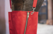 Close-up view of the zipper on the Cordura Ice Boots in red
