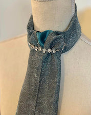 Close-up view of the teal Royal Iron Equestrian Ice Queen Stock Tie on a mannequin