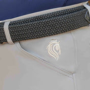 Close-up view of the logo near the front pocket on the  tan Equinavia Karl Men's Knee Patch Breeches