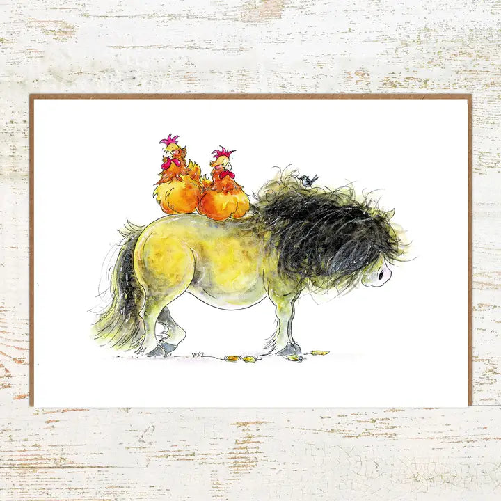 View of the Roosting Pony Nut Greeting Card on a white washed wood background
