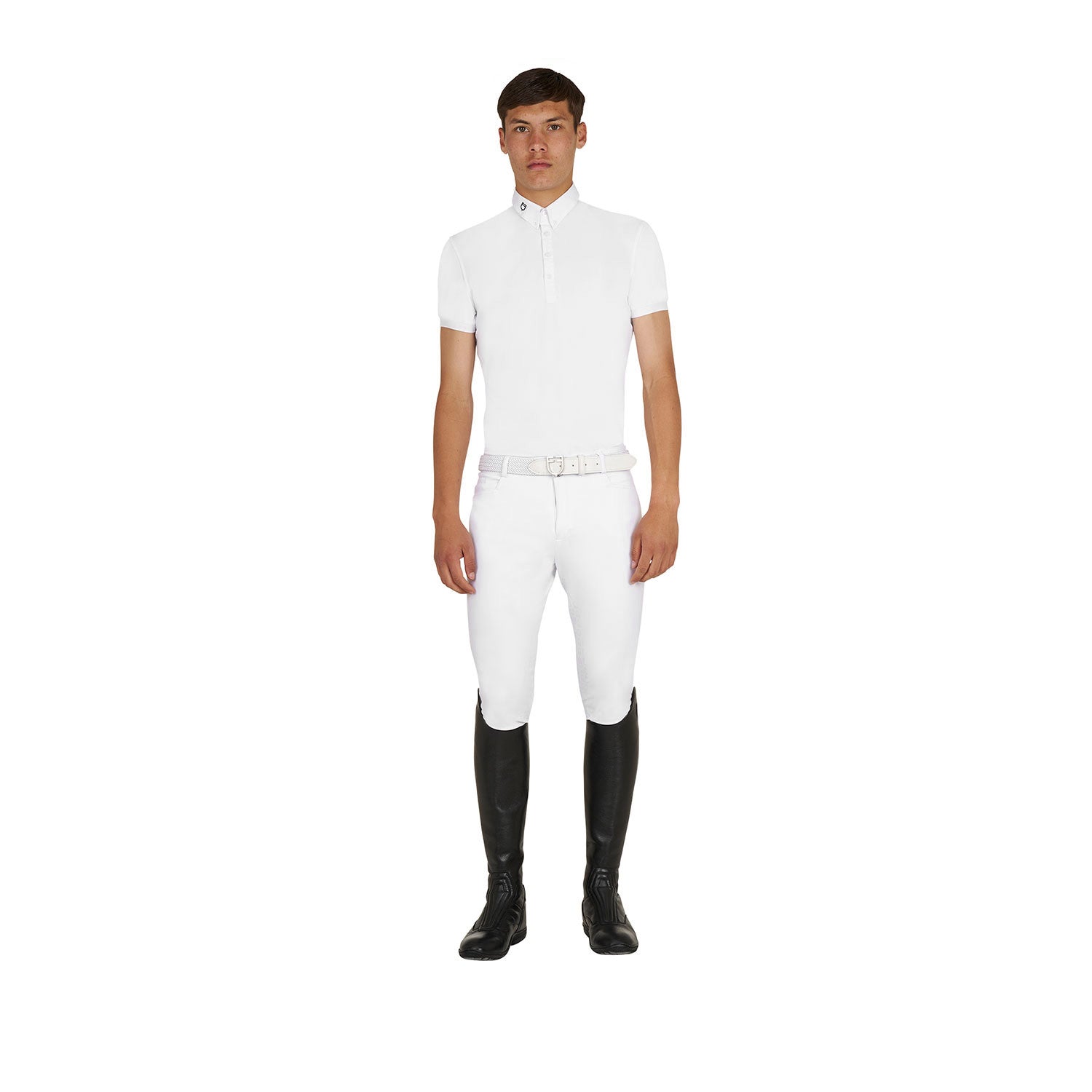 Full body front view of model wearing the Equestro Men's Competition Polo Shirt In Breathable Technical Fabric in white, white breeches, and tall black boots on white background