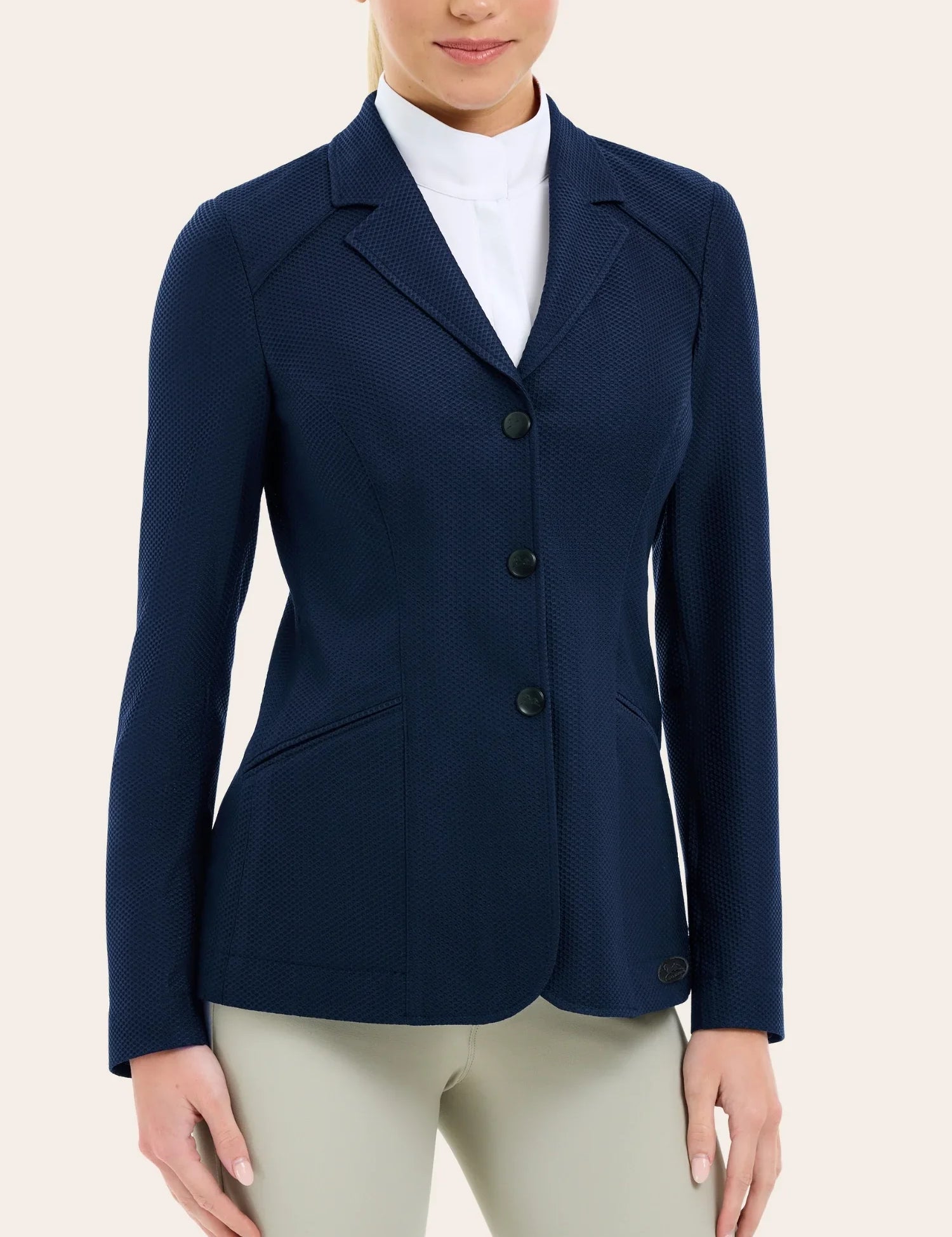 Angled front view of a female model wearing the navy RJ Classic Addison Air Mesh Coat on a plain background