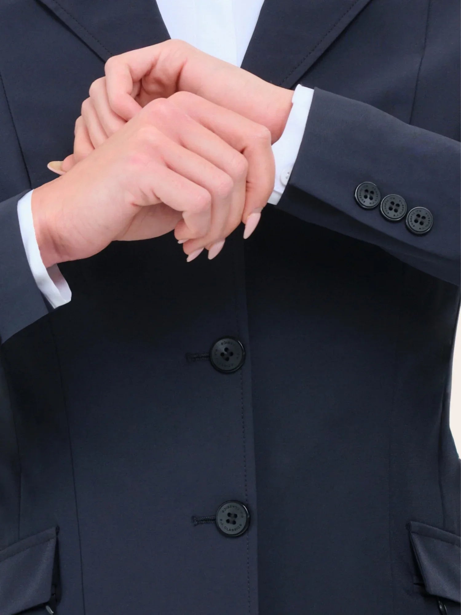 Close-up view of the sleeve cuffs on the navy RJ Classics Legacy Lite Jr Show Coat