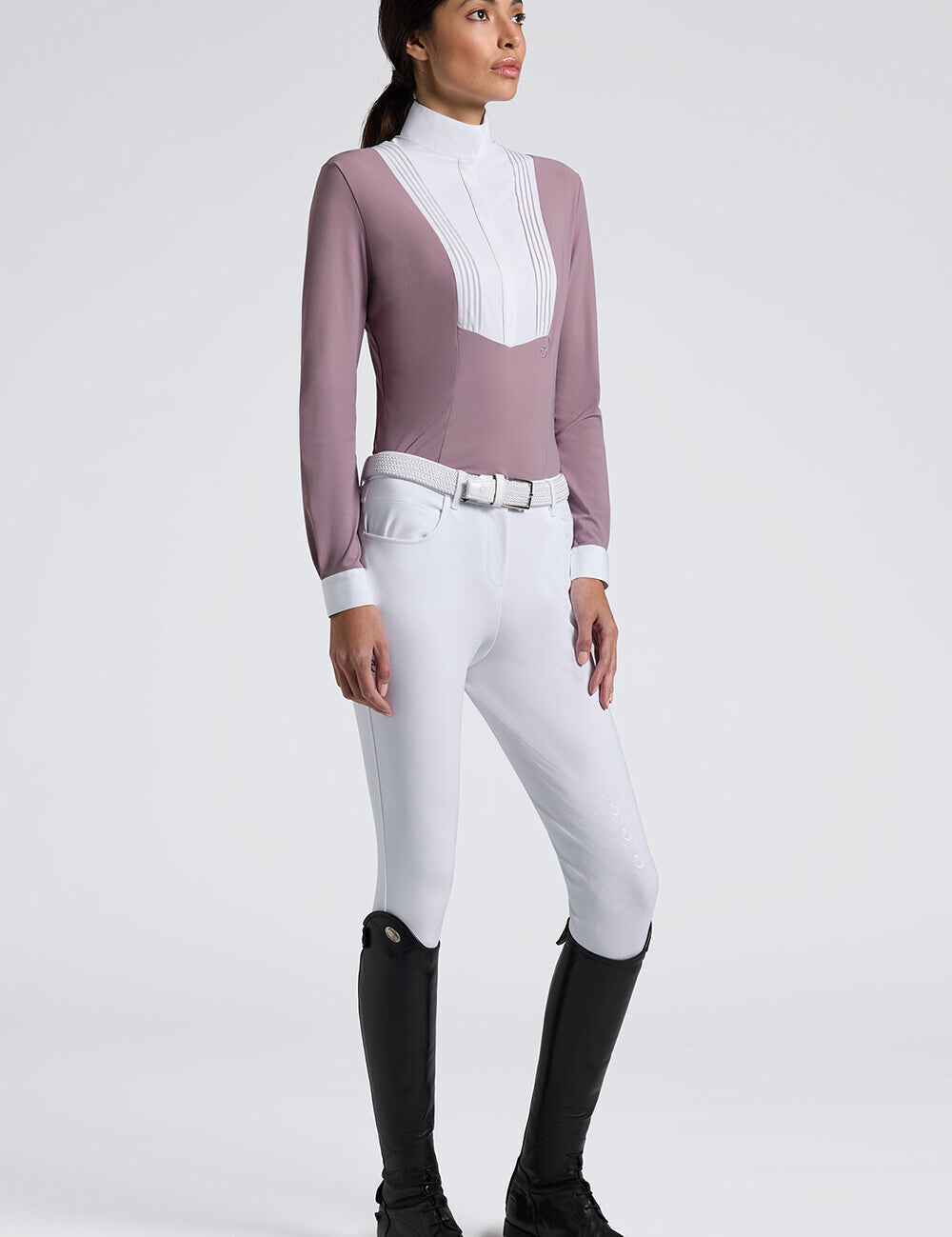 Angled front view of a female model wearing the purple Cavalleria Toscana American Long Sleeve Competition Shirt on a plain background