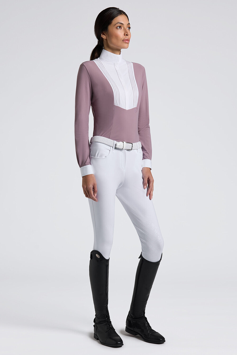 Angled front view of a female model wearing the purple Cavalleria Toscana American Long Sleeve Competition Shirt on a plain background
