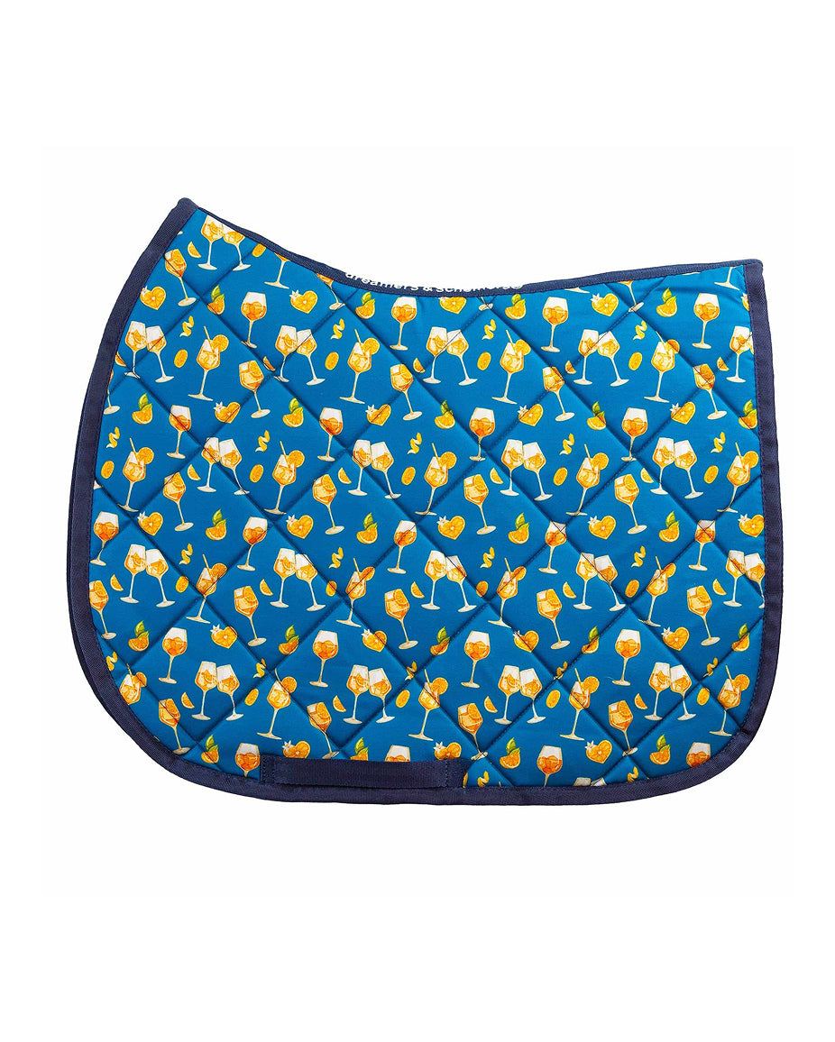 Side view of the Aperol Spritz Dreamers & Schemers Saddle Pad on a white background