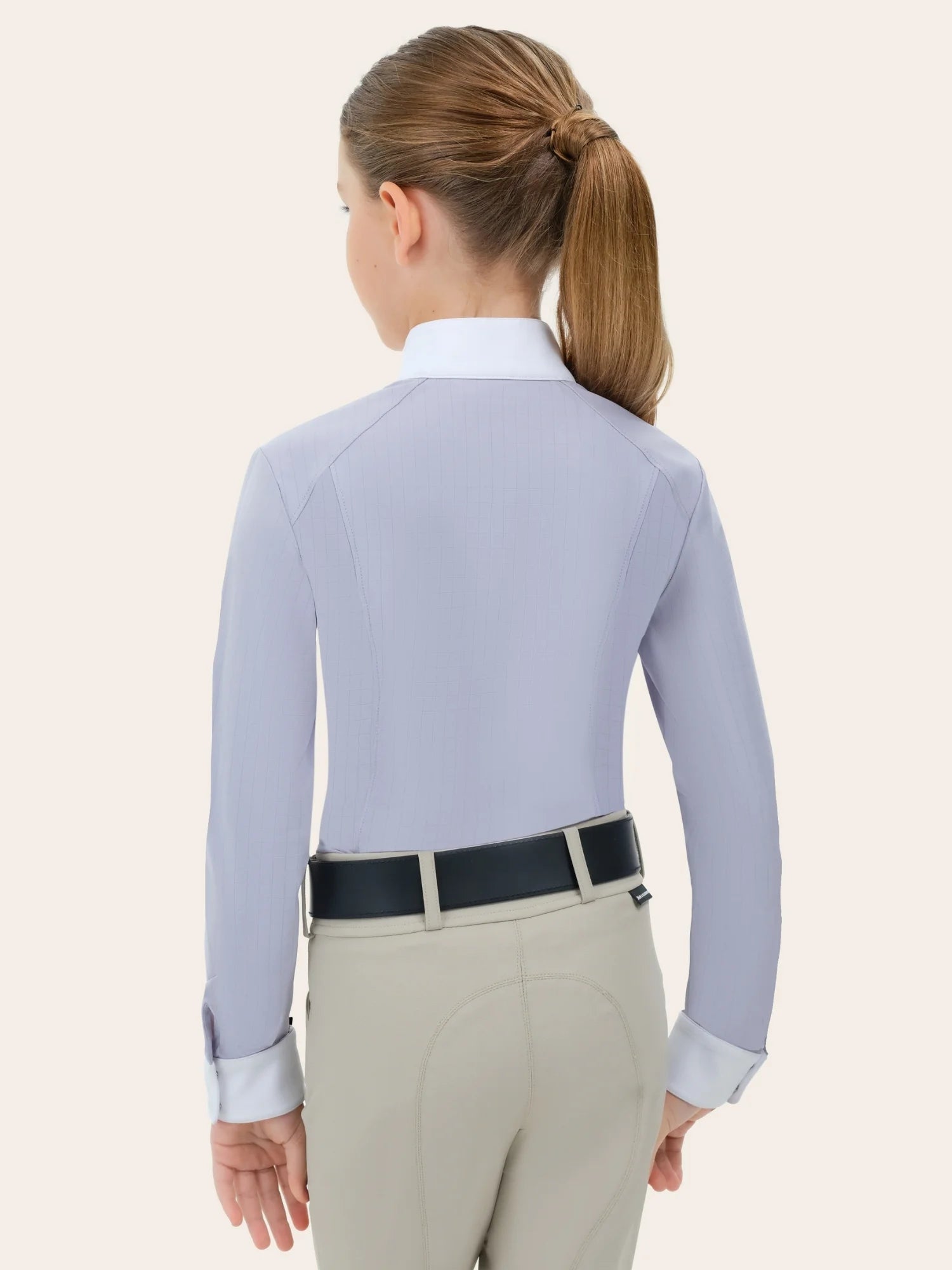 Back view of a young female model wearing the lavender RJ Classics Brooke Jr. Show Shirt on a plain background