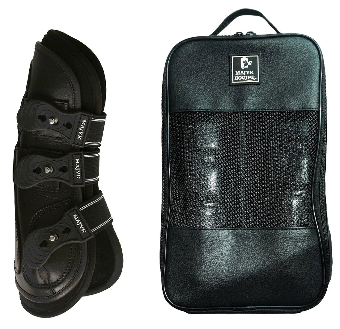 Majyk Equipe Boyd Martin leather tendon boots in black shown next to a black carrying case with mesh front panel