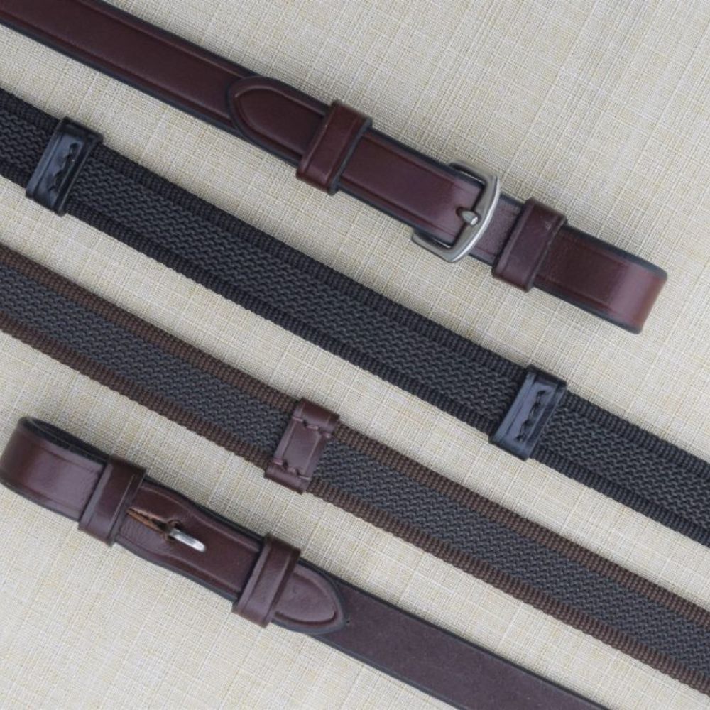 Side-by-side front and back views of a brown pair and black pair of Black Oak Monley Grip Reins on a textured background
