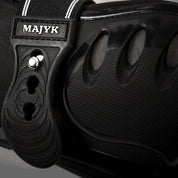 Close-up of Majyk Equipe Boyd Martin Stadium Tendon Jump Boot in black showing shell detail and strap closures