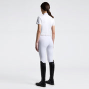 Full body back view of a model wearing the white Cavalleria Toscana Perforated Short Sleeve Competition Shirt and white breeches on a plain background