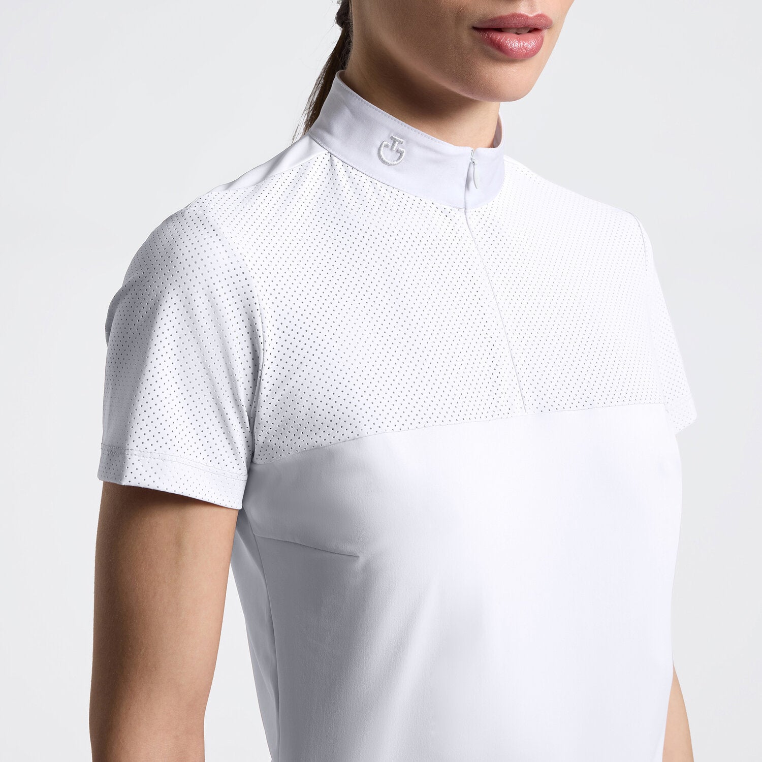 Close-up front view of a model wearing the white Cavalleria Toscana Perforated Short Sleeve Competition Shirt on a plain background