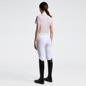 Full body back view of a model wearing the pink Cavalleria Toscana Perforated Short Sleeve Competition Shirt and white breeches on a plain background