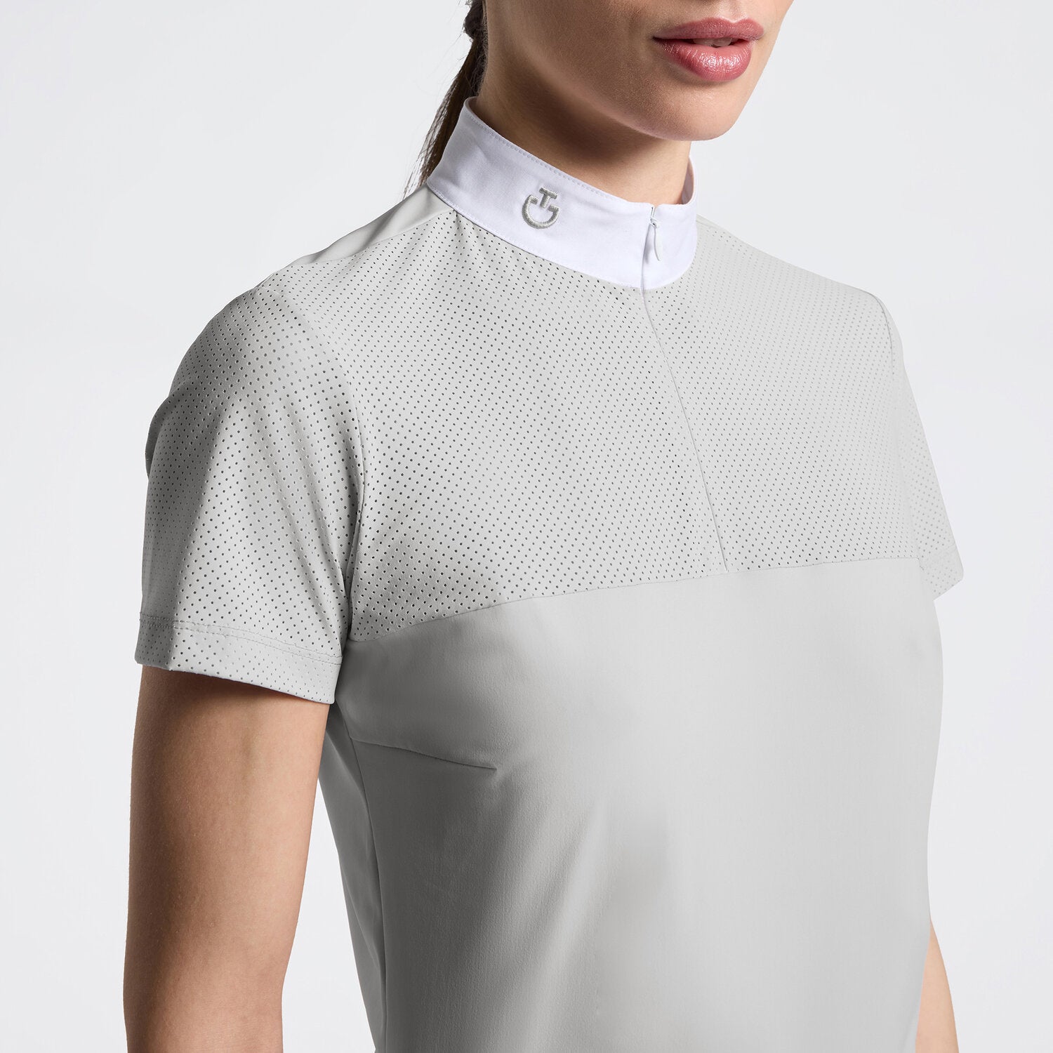 Close-up front view of a model wearing the gray Cavalleria Toscana Perforated Short Sleeve Competition Shirt on a plain background