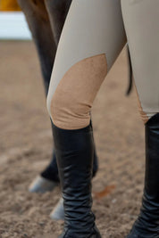 Close-up view of the suede knee patch on the beige Free Ride PRO Knee Patch Breeches