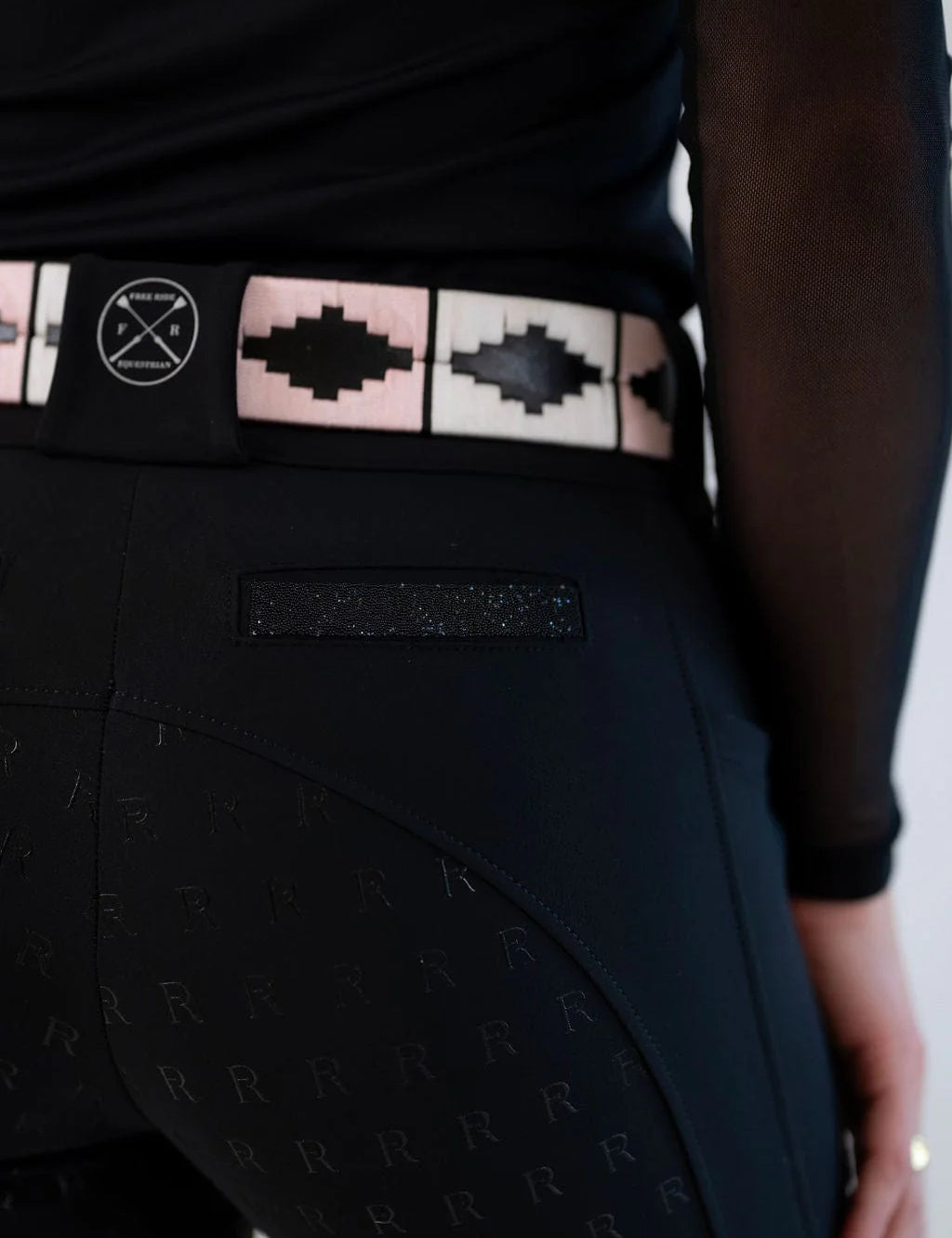 Close-up back view of the pocket sparkles on the black Free Ride  Sparkle PRO Full Seat Breeches