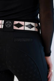 Close-up back view of a female model wearing the black Free Ride PRO Full Seat Breeches