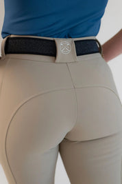 Back view of a model wearing the beige Free Ride PRO Knee Patch Breeches on a plain background