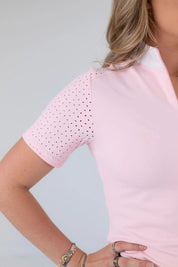 Close-up view of the laser cut perforations on the sleeve of the pink Free Ride Cassidy Short Sleeve Show Shirt