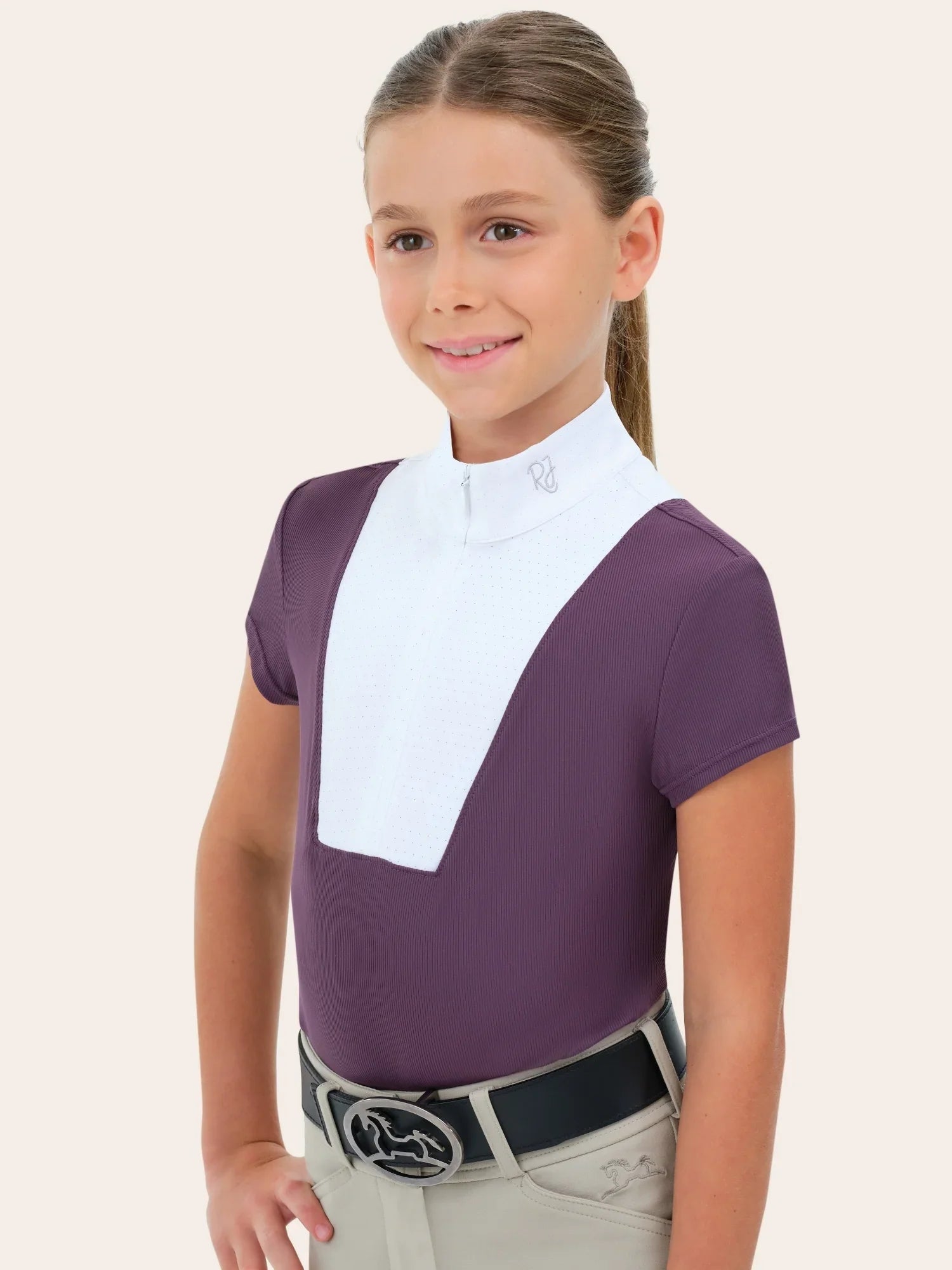 Child wearing RJ Classics Celeste Jr. Show Shirt in grape, front view with belt and tan breeches