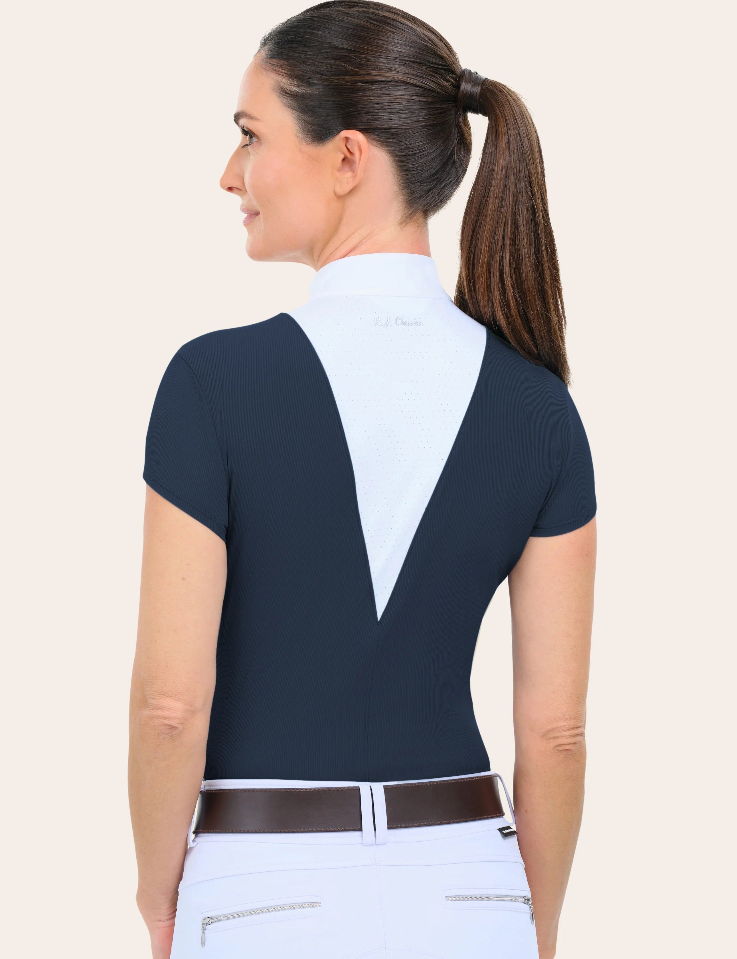 Back view of a female model wearing the navy RJ Classics Celeste Show Shirt on a plain background