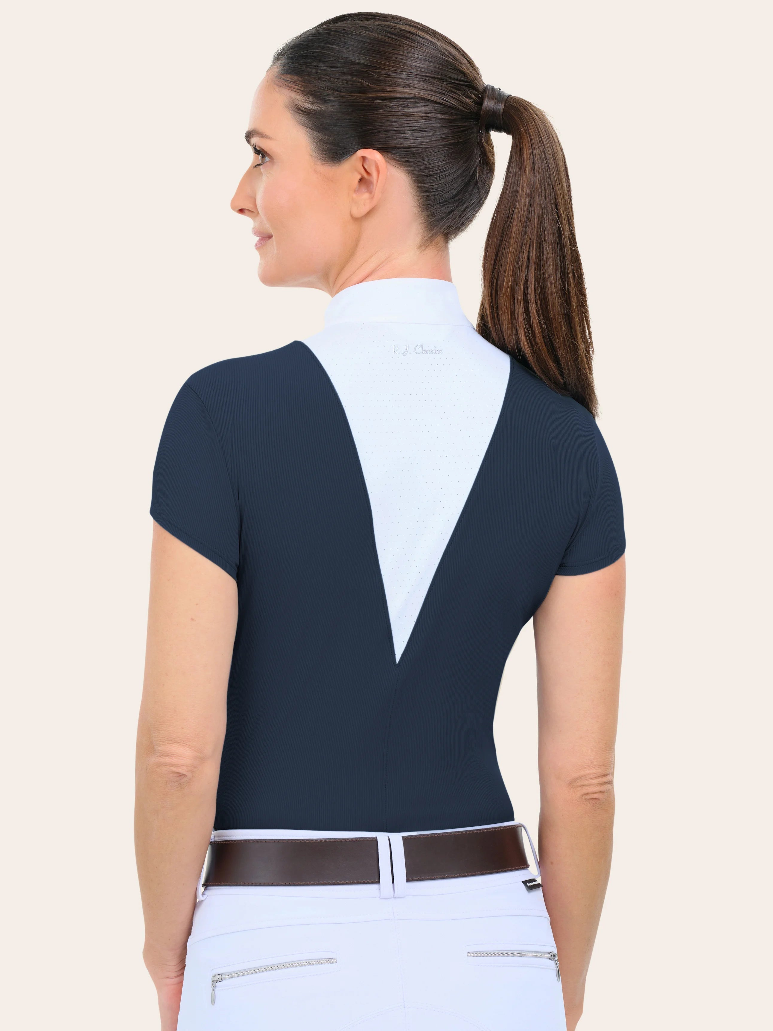 Back view of a female model wearing the navy RJ Classics Celeste Show Shirt on a plain background