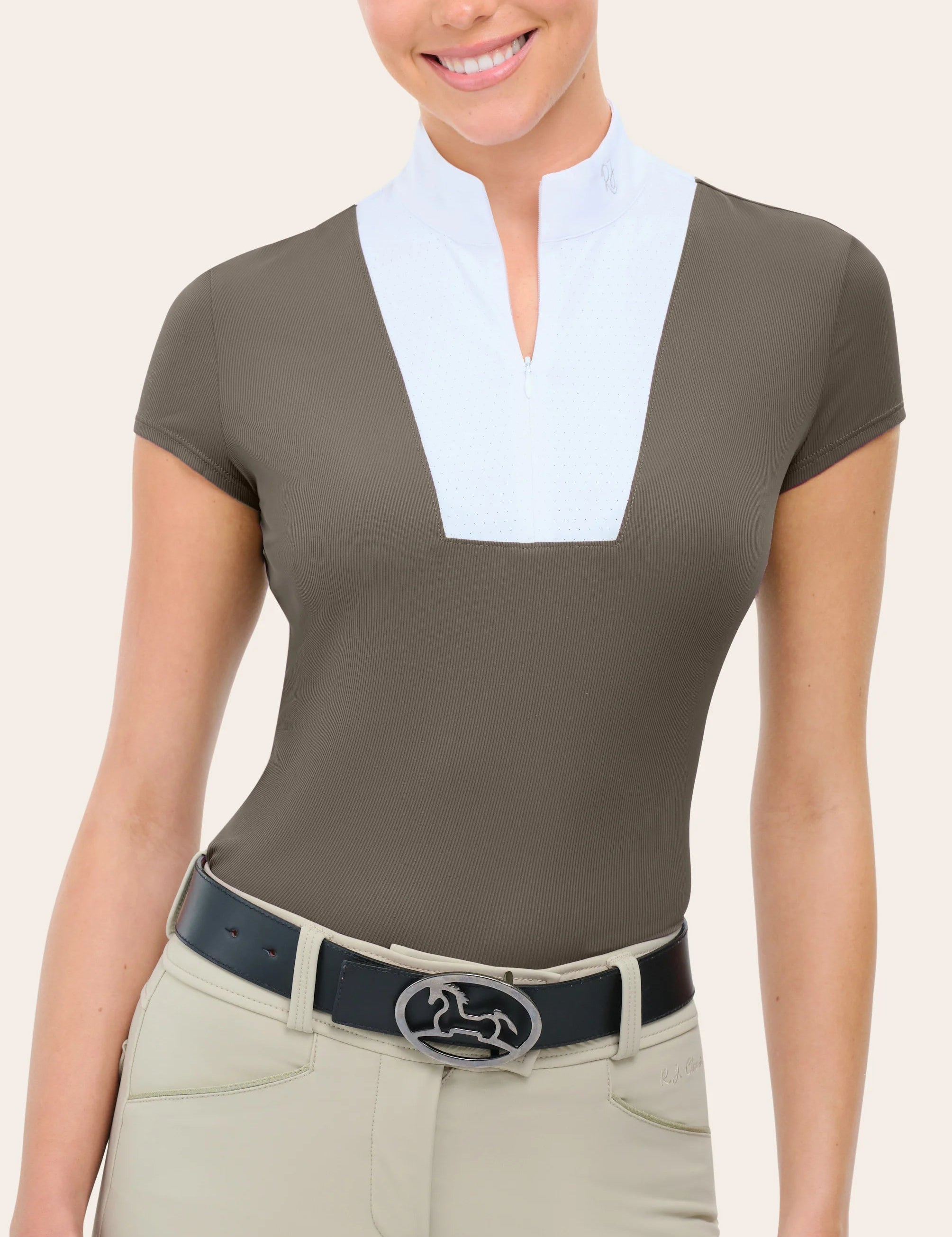Woman wearing RJ Classics Celeste Show Shirt in Taupe, front view with belt and breeches