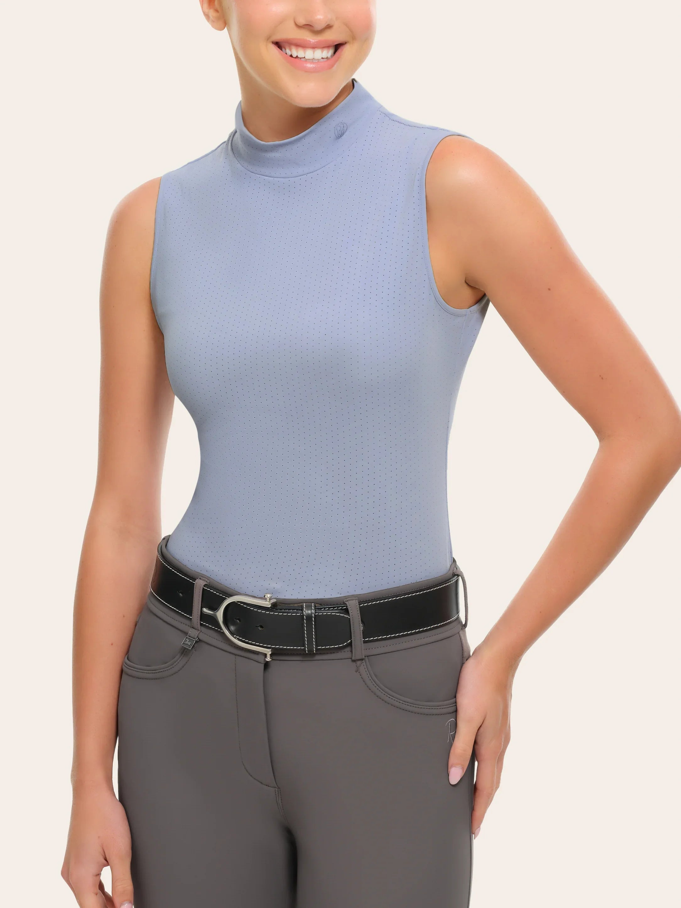 Front view of a female model wearing the blue RJ Classics Corrie Mock Neck Shirt on a white background