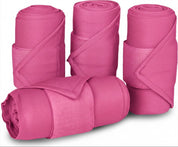 Front view of 4 pink Equi-Essentials Poly Standing Wraps on a white background