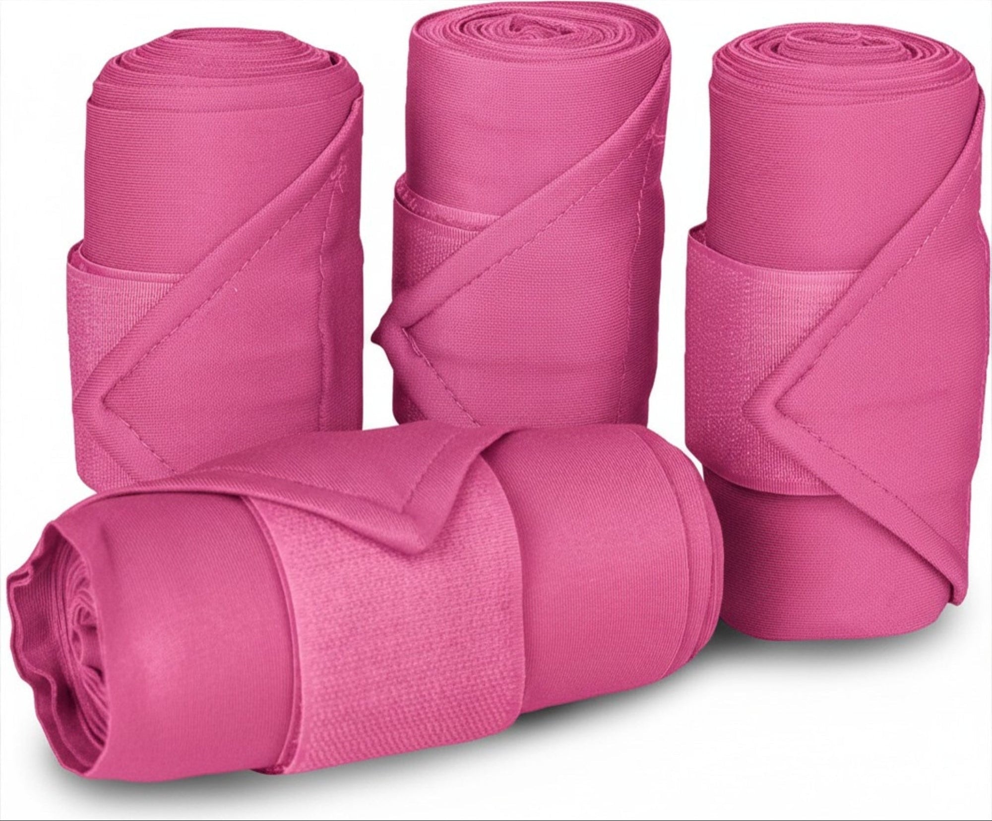 Front view of 4 pink Equi-Essentials Poly Standing Wraps on a white background