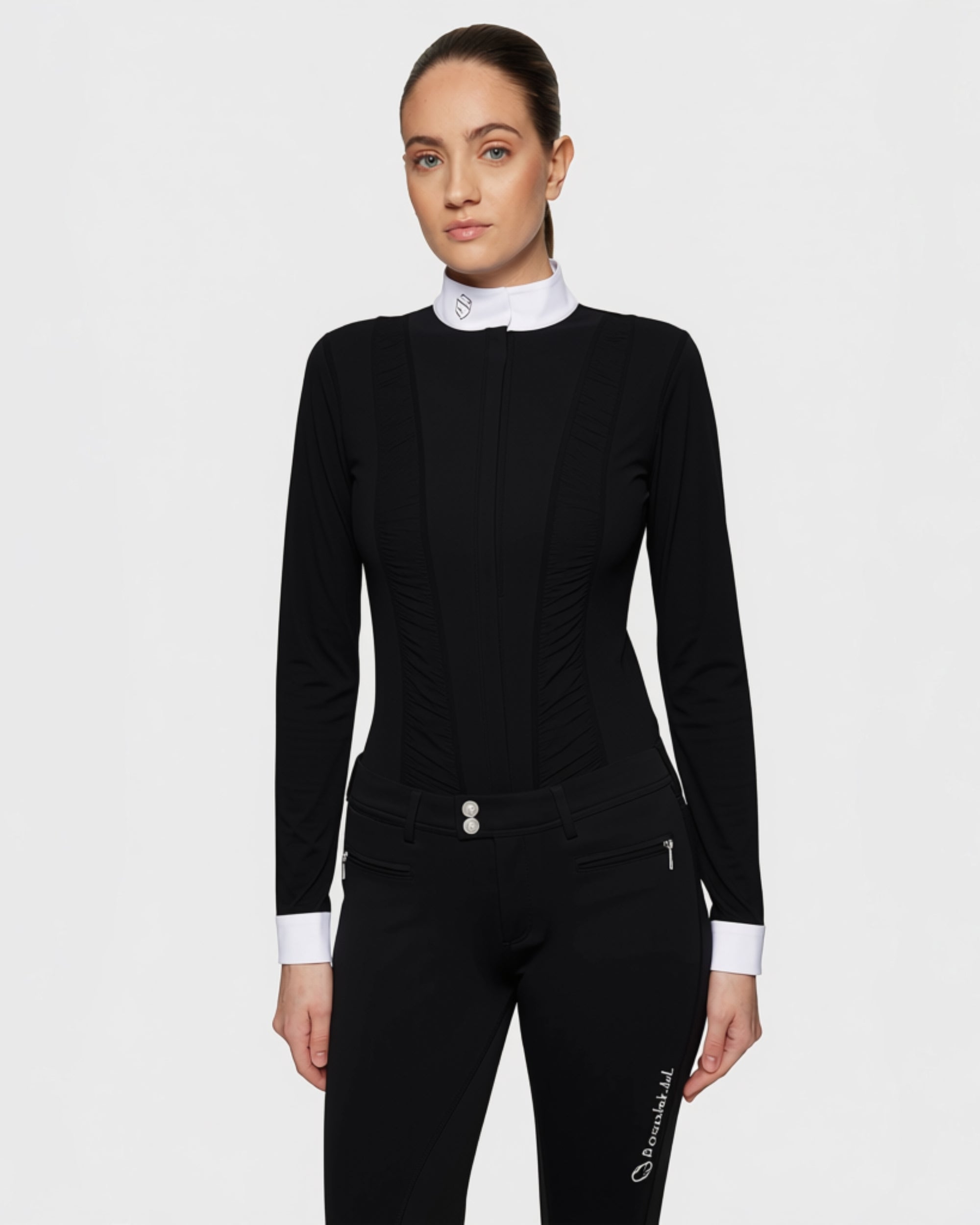 Front view of a female model wearing the Black Samshield Marina Long Sleeve Show Shirt on a plain background
