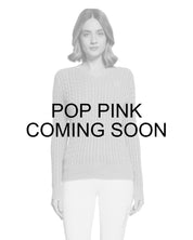Coming Soon infographic showing a female model wearing the Pop Pink Samshield Lisa Twisted Sweater on a plain background