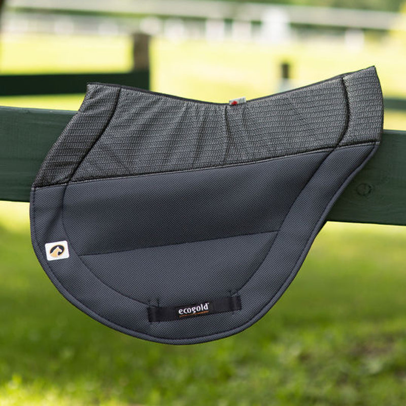 Side view of the charcoal Ecogold Secure Cross Country Pad on a green fence board