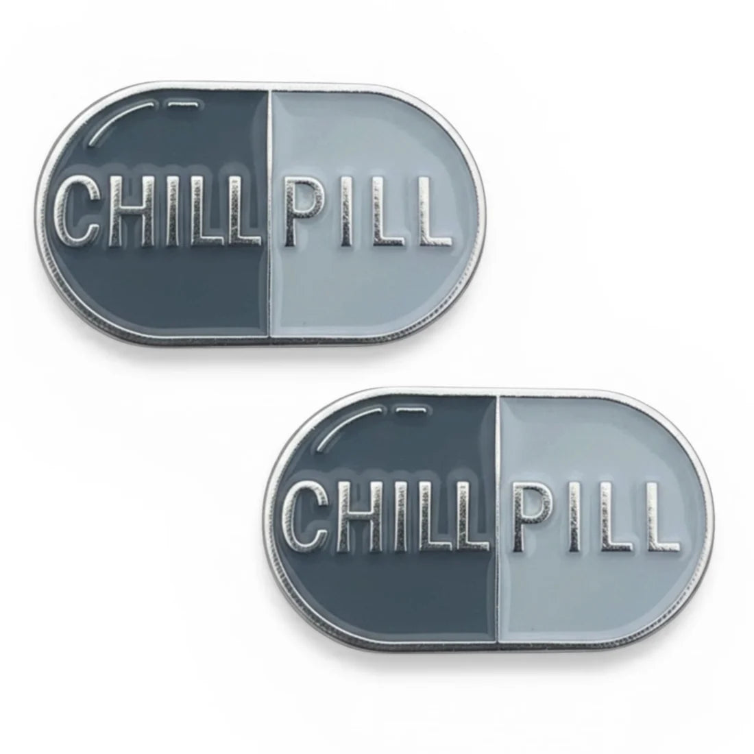 Front view of a pair of Chill Pill Dubois Cheval Number Pin Charm on a white background