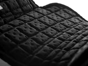 Close-up interior view of the black Equilibrium Tri-Zone Impact Cross Country Front Boot on a white background