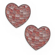 Front view of a pair of Disco Heart Dubois Cheval Number Pin Charm on a white background