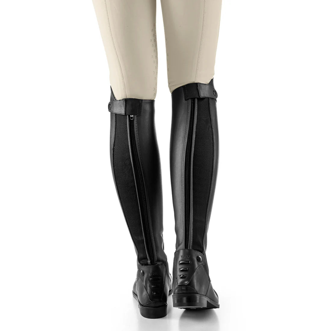 Back view of a model wearing a black pair of Ego 7 Orion Field Boot on a white background