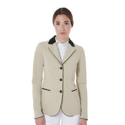 Front view of model wearing the Equestro Women's Three-Button Competition Jacket in tan on a white background