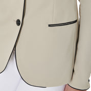 Close up view of the front pocket with black accent on the Equestro Women's Three-Button Competition Jacket in tan on a white background