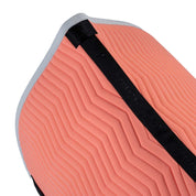 Close up top view of the Equestro Wave Quilting Jump Saddle Pad In Technical Fabric in a coral color on a white background