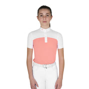 Front view of young model wearing the Girls' Slim Fit Competition Polo Shirt With Perforated Fabric in white and pink on a white background